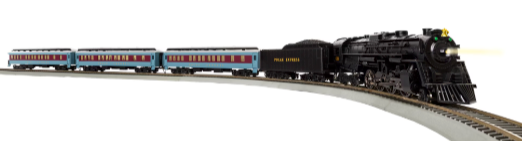 Model steam locomotive with passenger cars on a track