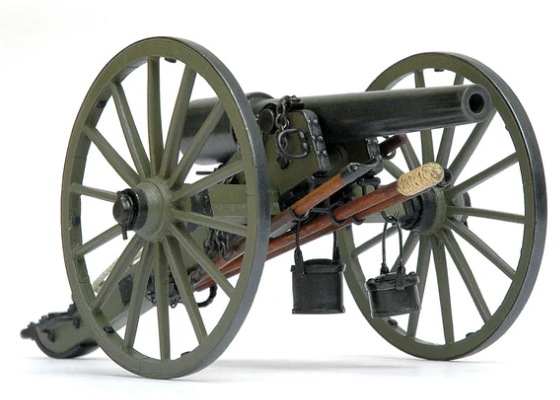 Model of a historical cannon with large wheels on a white background