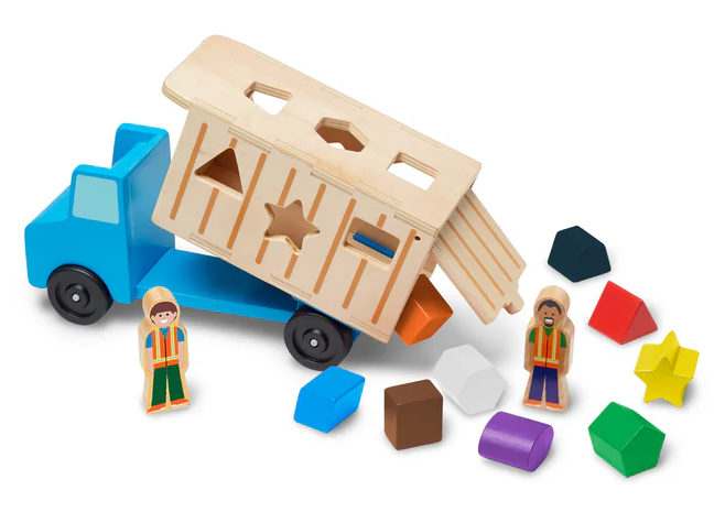 Toy truck with wooden container, colorful blocks, and figures on a white background
