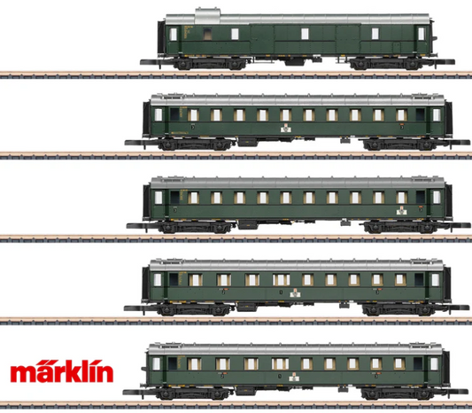Set of model train cars on tracks with Märklin logo.
