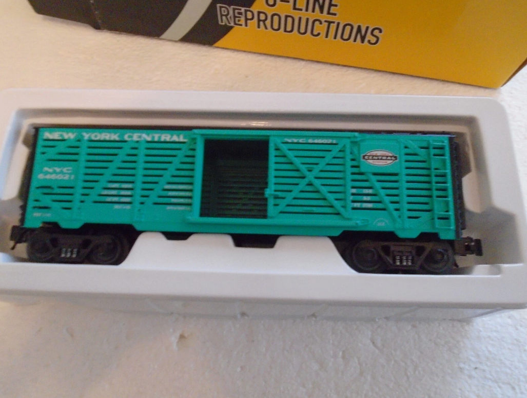 Model train car with 'New York Central' branding in a box on a light background