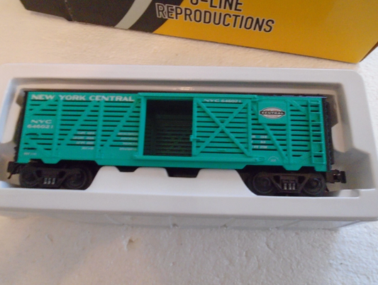 Model train car with 'New York Central' branding in a box on a light background