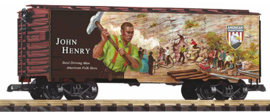 Model train car with John Henry artwork on a wooden platform