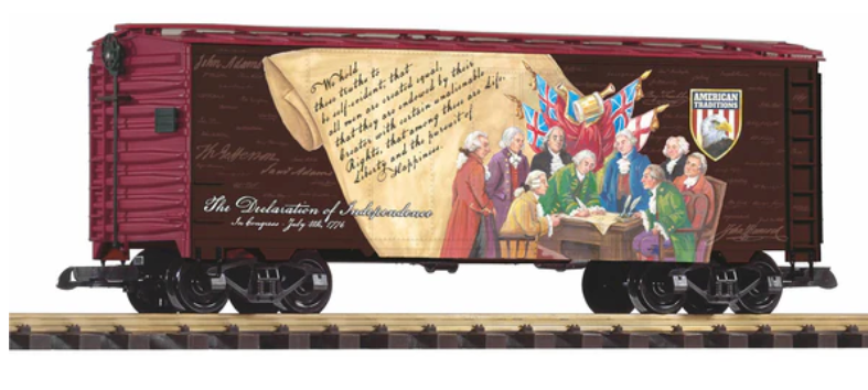 Model train car with historical illustration on a wooden background