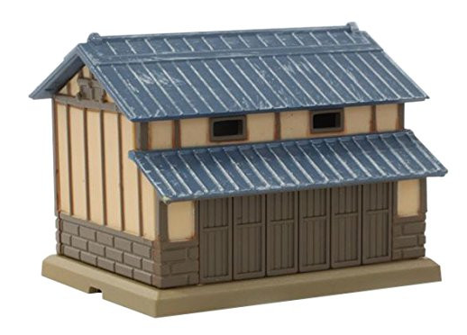 Model of a traditional Japanese building with wooden exterior and tiled roof on a white background