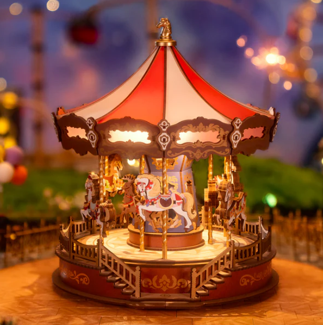 Decorative carousel model with lights on a blurred background