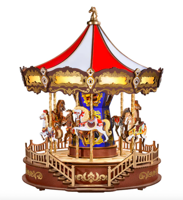 Wooden carousel toy with colorful horses on a white background