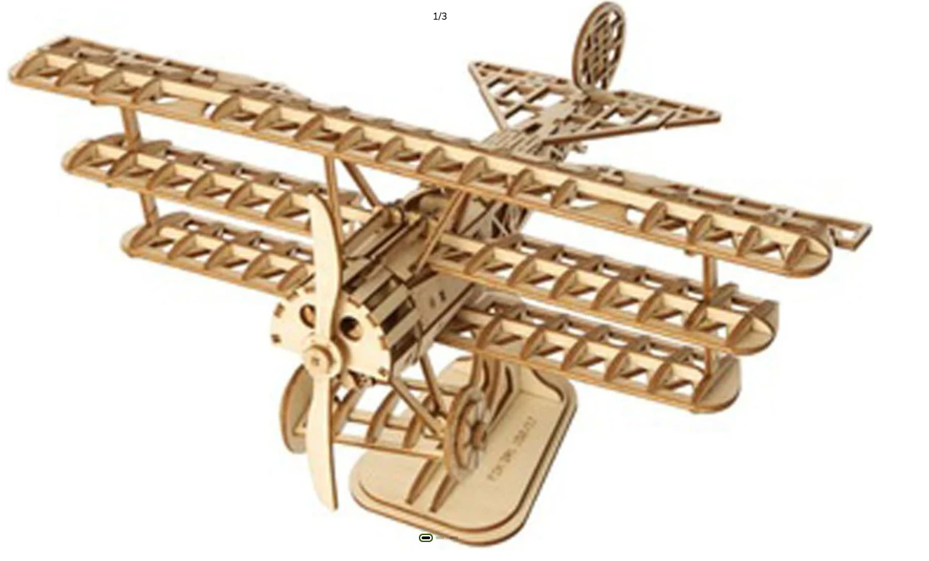 Wooden biplane model on a white background