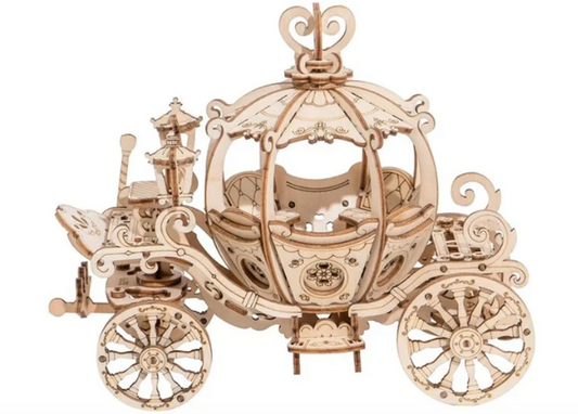 Wooden model of a horse-drawn carriage on a white background