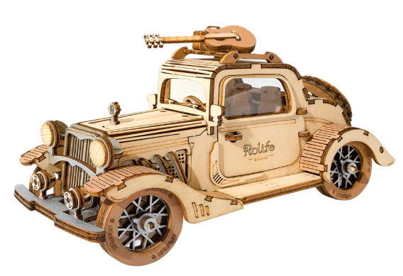 Wooden model car with mechanical components on a white background