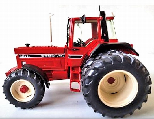 Red International tractor with dual rear wheels