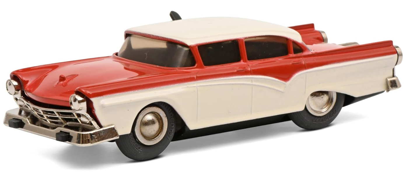 A Schuco Micro Racer Fairlane 1045 model car in red and beige colors with a wind-up motor, presented on a white background.