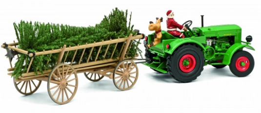 Santa on a green tractor hauling a Christmas tree