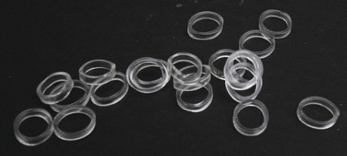 A set of clear, rubber traction tires for model trains.