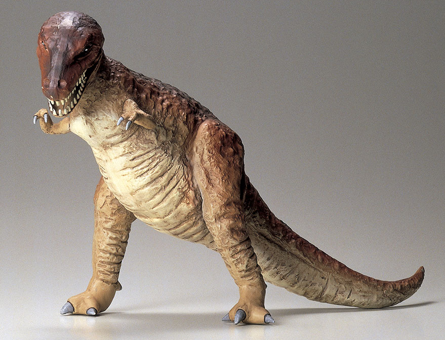 Dinosaur toy figure on a gray background