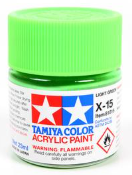 Tamiya green acrylic paint can on a white background