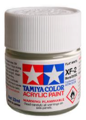 Tamiya acrylic paint can with white cap on a black background