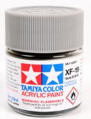 Acrylic paint can with gray color swatch on a white background