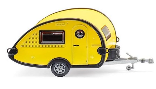 Yellow toy caravan with a trailer on a white background