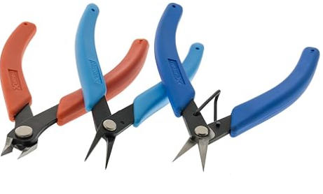 Set of three pairs of pliers with blue and red handles on a white background