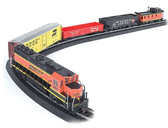 A model train set featuring a red and black EMD GP40 diesel locomotive with a quad hopper gondola and a signal bridge. The set is on curved track with a black background.