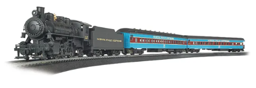 A toy model of a North Pole Express train set with a black and blue steam locomotive, a blue and silver tender, and a blue and red observation car.