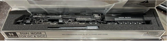 A model train, the Union Pacific Big Boy, in its packaging showing the detailed model with a black and gray color scheme.