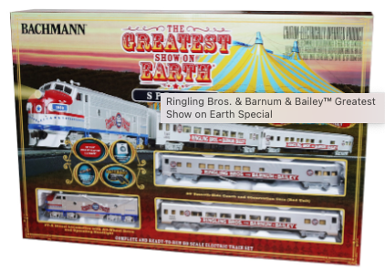A toy train set depicting the Ringling Bros. and Barnum & Bailey Circus with a diesel locomotive, smooth-side coach, and observation car in boxed packaging.