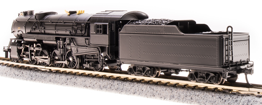 Black steam engine and tender