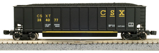 A set of four black model train cars with the CSXT logo in yellow.