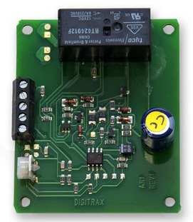 A Digitrax AR1 Auto Reverser for model trains, featuring a green circuit board with various electronic components and a black control knob.