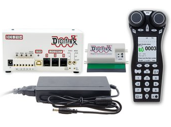 A set of Digitrax model train control equipment including a command station, throttle, radio transceiver panel, and power supplies.