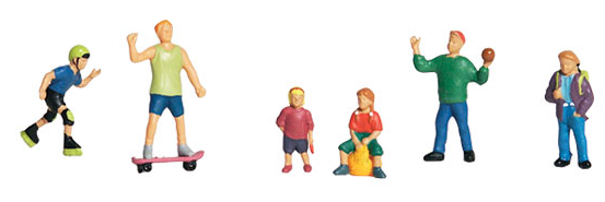 A set of six miniature figures designed for model train setups, depicting various playful scenarios with children. Each figure is painted in different colors, with outfits that suggest casual play.