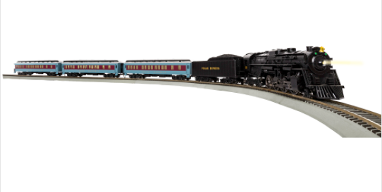 A toy train set depicting a steam locomotive with multiple cars and tracks, all in a white and scenic layout.