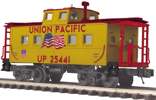 A model of a Union Pacific steel caboose with a center cupola, featuring a yellow and red livery with the Union Pacific logo.