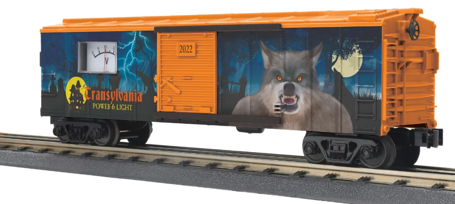 An orange and black toy train box car with a zombie-themed graphic and a power meter on the side.