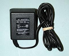A black 4.5 Volt AC adapter with a power cord, designed for running electric signs.
