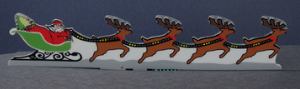 Animated neon sign featuring Santa Claus and a reindeer sleigh with a base similar to a drive-in sign.