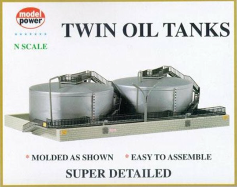 N scale twin oil tank model kit by Model Power, showing two gray plastic tanks with various detail parts and emblems.