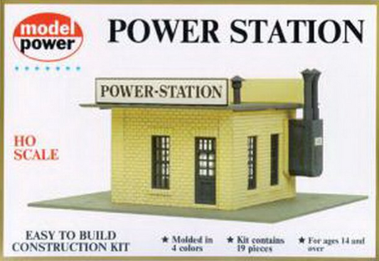 HO Scale Power Station Building Kit packaging with a model of a power station building in yellow, black, and gray colors.