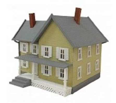 A model of a two-story house with a gray roof, yellow body, and a small figurine in front.