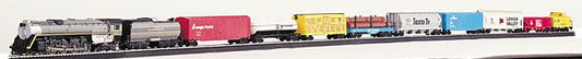 A toy train set featuring a steam locomotive with a yellow tender and multiple rail cars including a flat car with logs and a caboose.