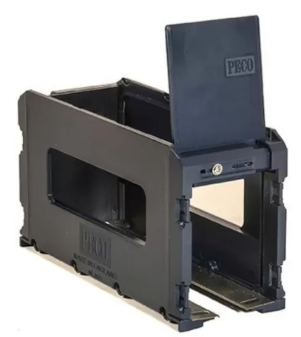 A black Peco brand model train loco lift with two sliding shutter doors.