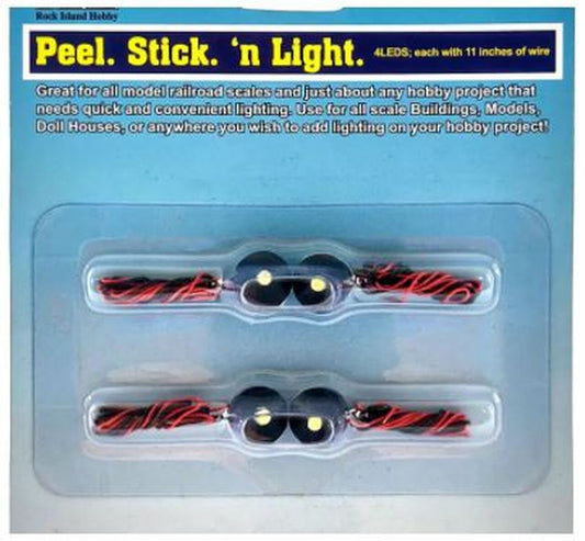 Four LED Peel, Stick, 'n Light LED lights in packaging, designed for use with model trains and other hobby models, showing two-sided tape for attachment.