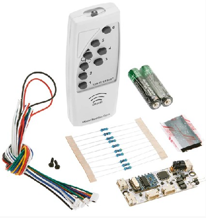 A wireless light genie transmitter and receiver system with various components laid out, including incandescent bulbs, LEDs, a 9V battery, and wiring.