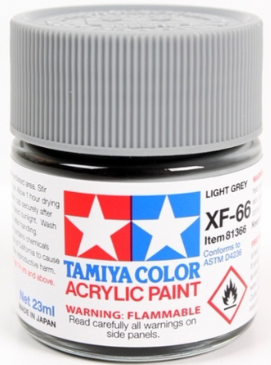 A 23ml bottle of Tamiya brand acrylic paint in light grey color, labeled as XF-66.