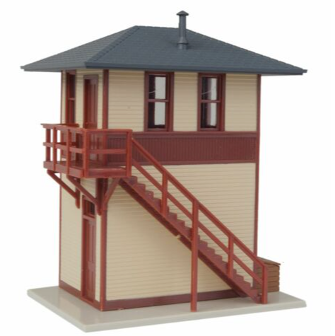 A WalthersTrainline trackside signal tower model with a wood exterior, featuring a detailed exterior stairway, windows, and a small storage box on top.