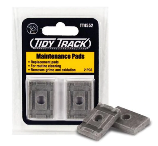 Packaging for Woodland Scenic 4552 Tidy Track Maintenance Replacement Pads, showing two grey foam pads and their packaging.