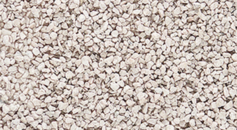Fine ballast material in a buff color, typically used for model train setups.
