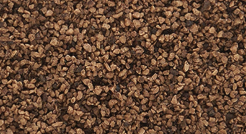 A shaker full of brown model train ballast.